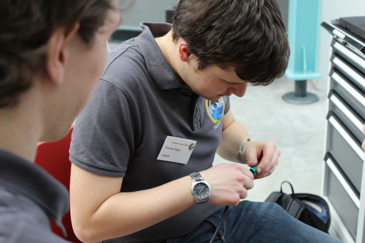 Tom is crimping some spare cables